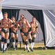 Half of the group date dudes in black singlets